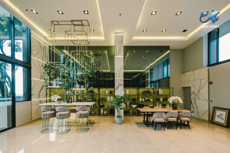 An elegant lobby space with decorative shelving, seating areas, and modern interior design elements.