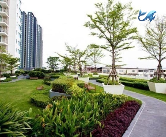 Beautifully landscaped garden with winding paths, vibrant plants, and ample green space.