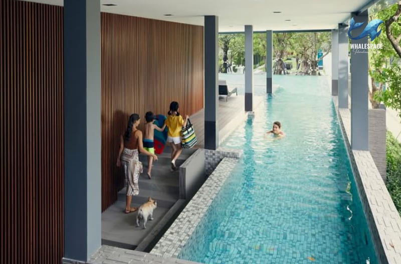 Long lap pool with a family enjoying a swim and a dog by their side