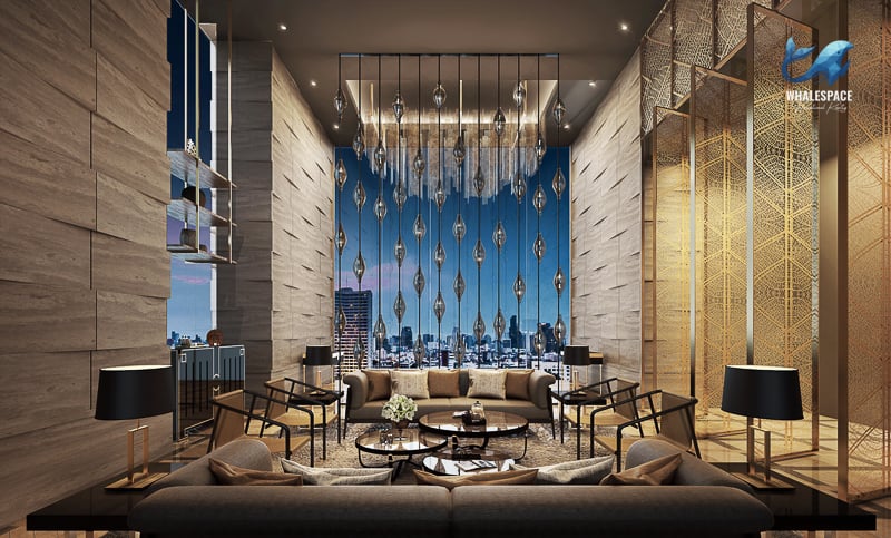 Sophisticated lounge area with intricate chandelier lighting, plush seating, and expansive city views at night through floor-to-ceiling windows