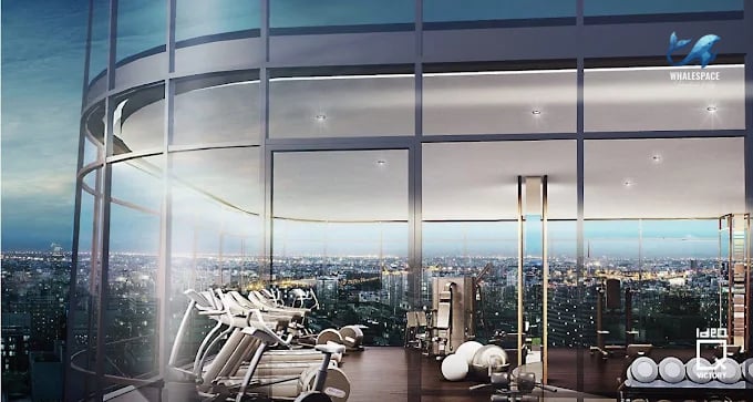 State-of-the-art fitness center with cardio machines and weights, offering panoramic city views
