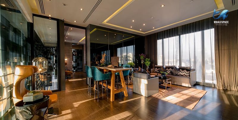 Stylish lounge area with bar seating and city views