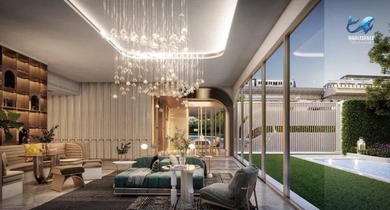 Modern lounge area with plush seating, dramatic chandelier, and large windows overlooking a green lawn and pool