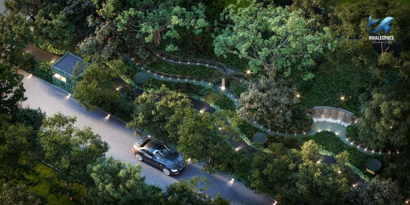 Lush green garden area with a winding pathway, accent lighting, and dense trees, seen from above.