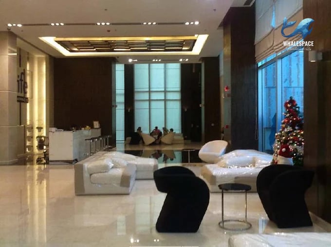 Elegant lobby with contemporary seating arrangements and a festive Christmas tree