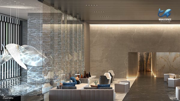 Elegant lobby with sophisticated seating, marble finishes, and dramatic lighting.