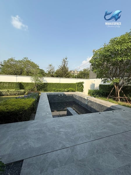 An inviting plunge pool set within a manicured garden, perfect for relaxation under the clear blue sky.