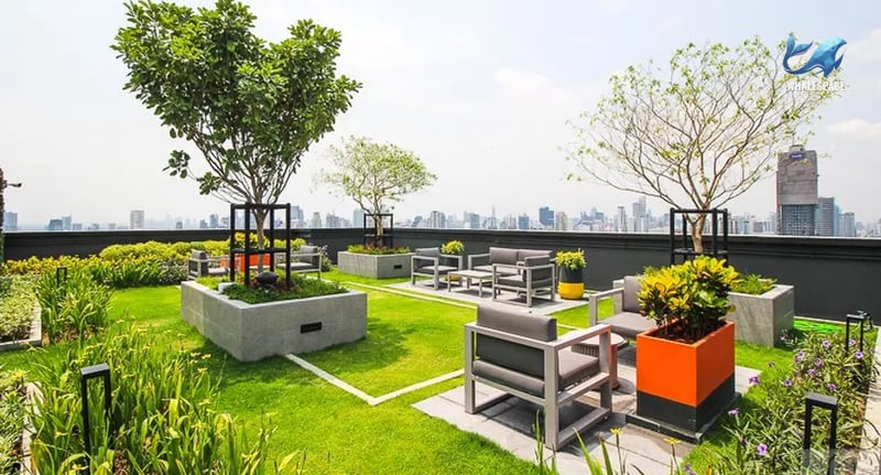 Elevated rooftop garden offering panoramic city views with sophisticated outdoor seating arrangements.