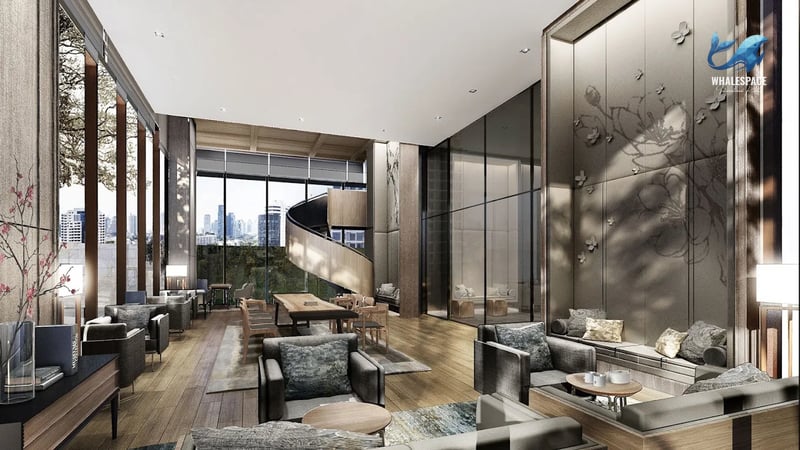 Elegant lobby lounge with high ceilings, plush seating, and a striking spiral staircase overlooking city views through expansive windows.