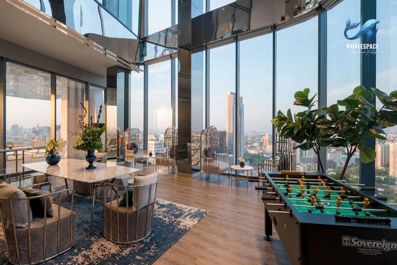 Stylish lounge area with foosball table and panoramic city views