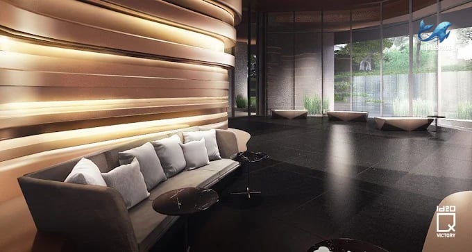Elegant lobby with a curved sofa and modern seating, featuring large windows overlooking greenery