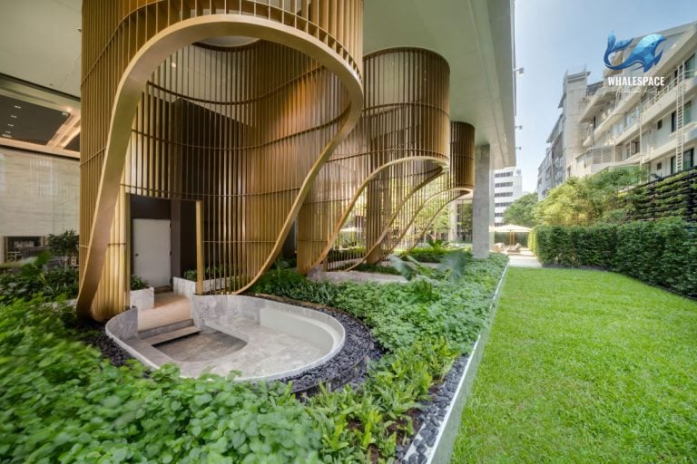 Serene garden pathway with intricate wooden architectural elements and manicured hedges