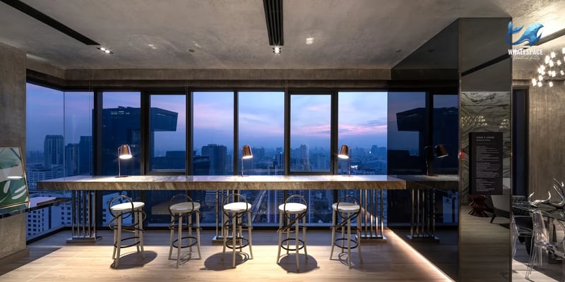 Stylish lounge area with bar seating and panoramic city views.