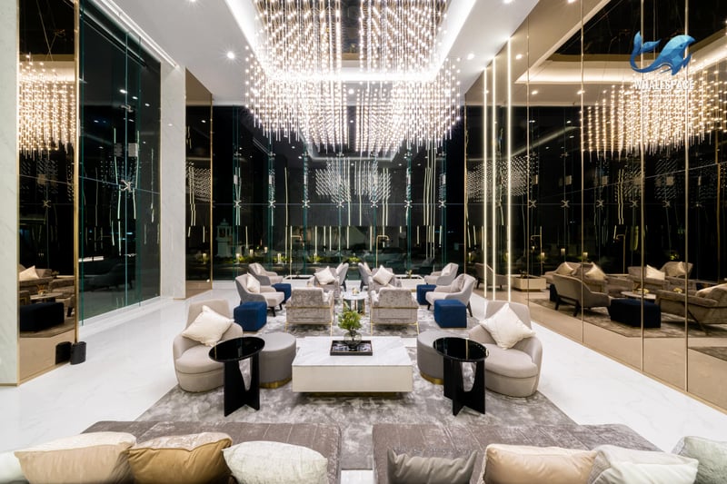 Luxurious lounge area with plush seating and dramatic chandelier lighting
