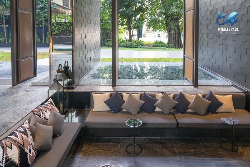 Modern lobby with comfortable seating and water feature