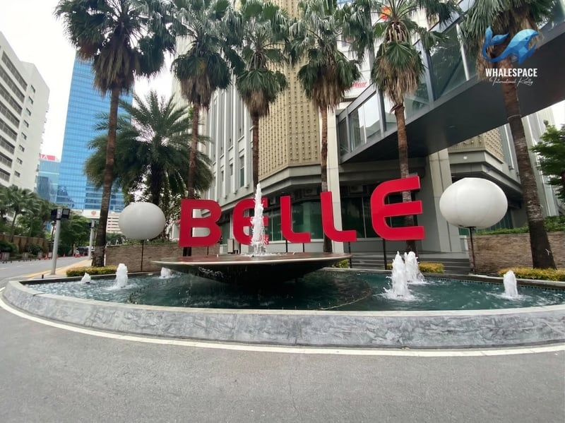 Grand entrance with a prominent 'Belle' sign and water fountain feature