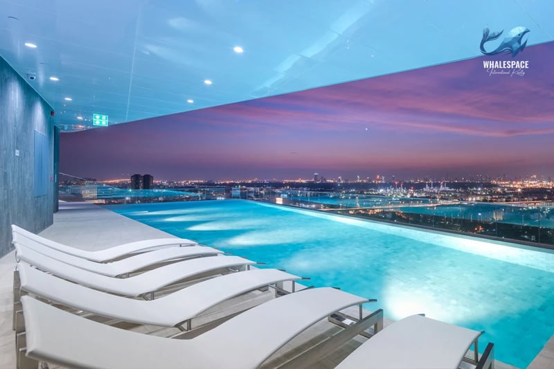 Stunning infinity pool overlooking the cityscape at sunset