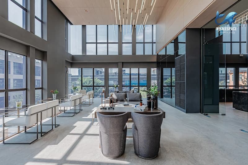 Elegant lobby lounge with high ceilings, ample natural light, and contemporary seating
