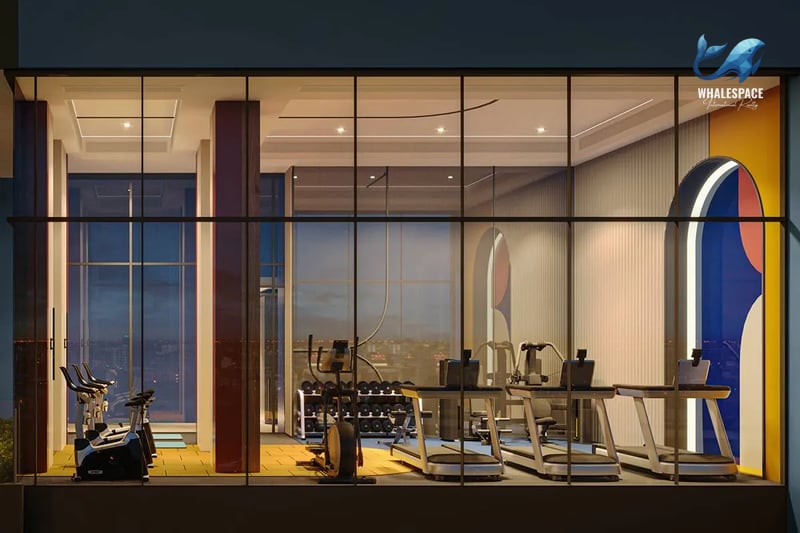 State-of-the-art fitness center with cardio machines and weights, offering panoramic city views.