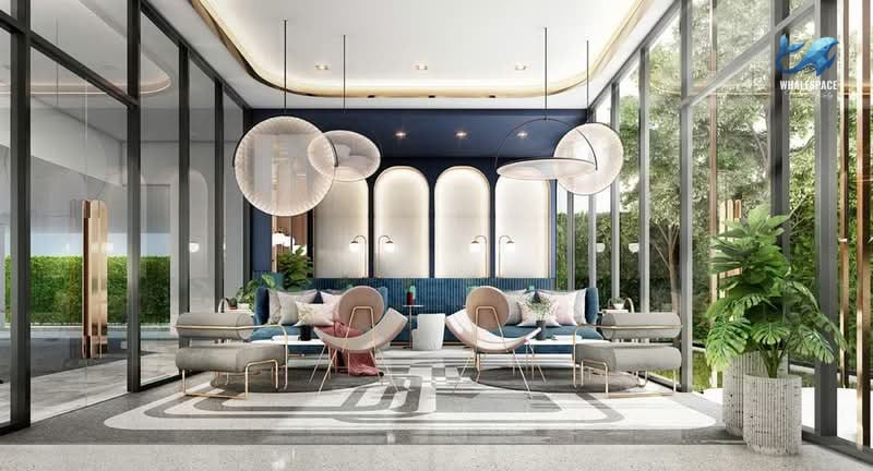 Elegant lobby featuring modern furniture, dramatic lighting, and large glass windows.