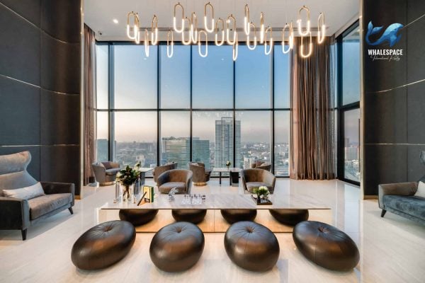 Elegant lounge area with plush seating and a stunning city view