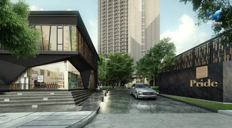Contemporary exterior of a condominium building with a prominent project sign and a sleek mini-mart entrance.