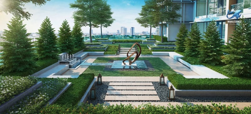 Landscaped rooftop garden with sculptures and manicured hedges