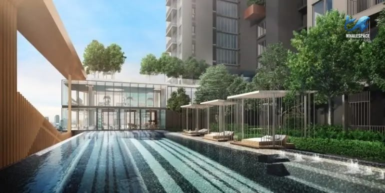 Resort-style swimming pool with submerged loungers and shaded relaxation areas