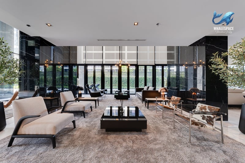 Luxurious lounge area with plush seating, marble accents, and ambient lighting.