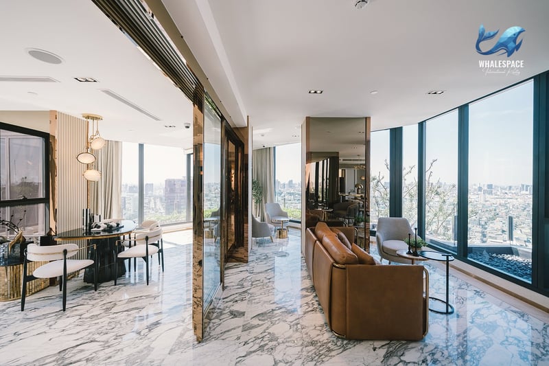 Elegant living and dining area with marble floors and city views