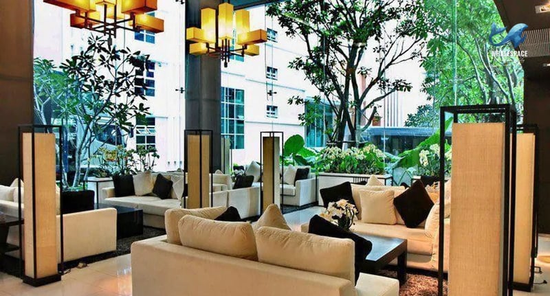 Elegant and spacious lobby with comfortable seating areas and sophisticated lighting.
