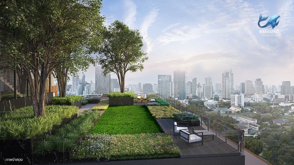 Rooftop garden with lush greenery, seating areas, and panoramic city views at sunset.