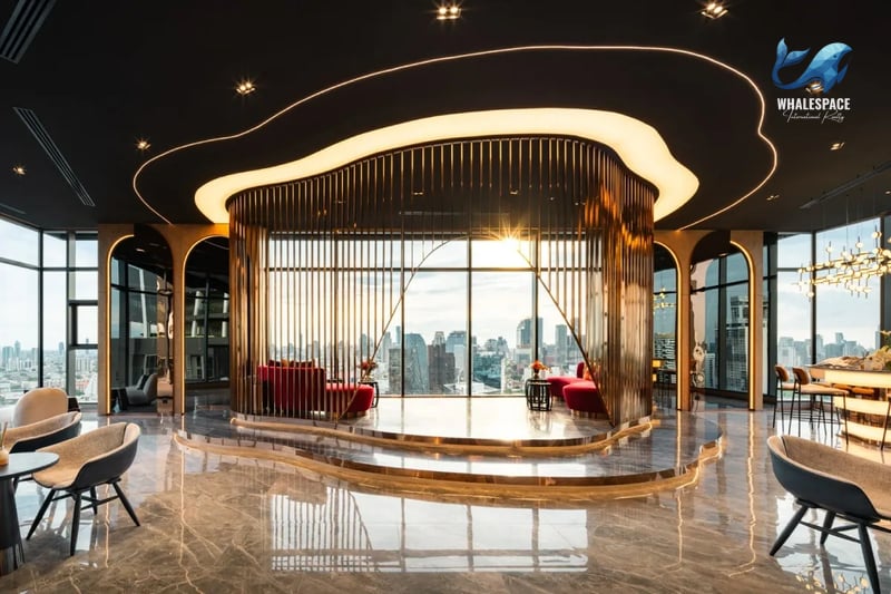 Glamorous sky lounge with marble floors, gold vertical accents, plush red seating, and expansive city vistas through large windows