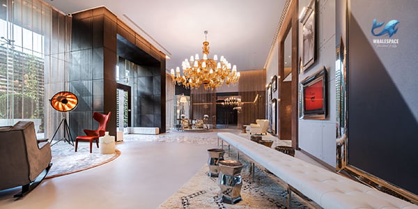 Grand hotel-style lobby with a large chandelier and plush seating areas.