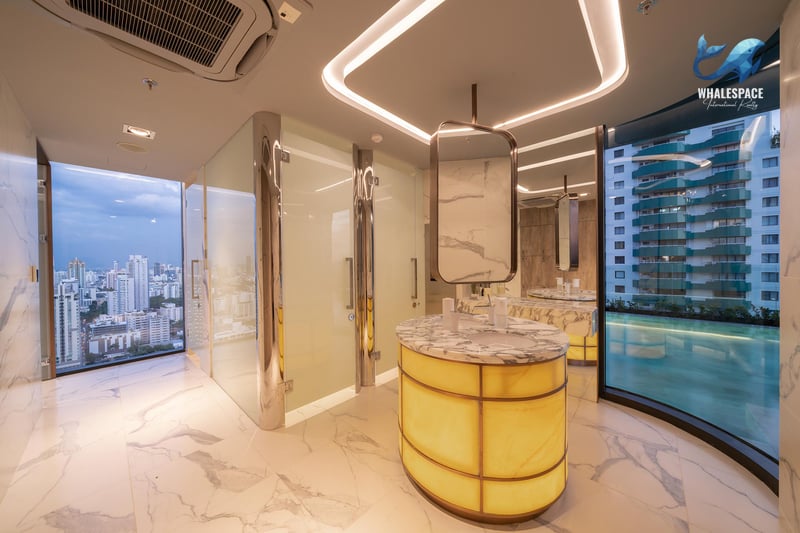 Elegant spa changing room with marble flooring, modern fixtures, and city views