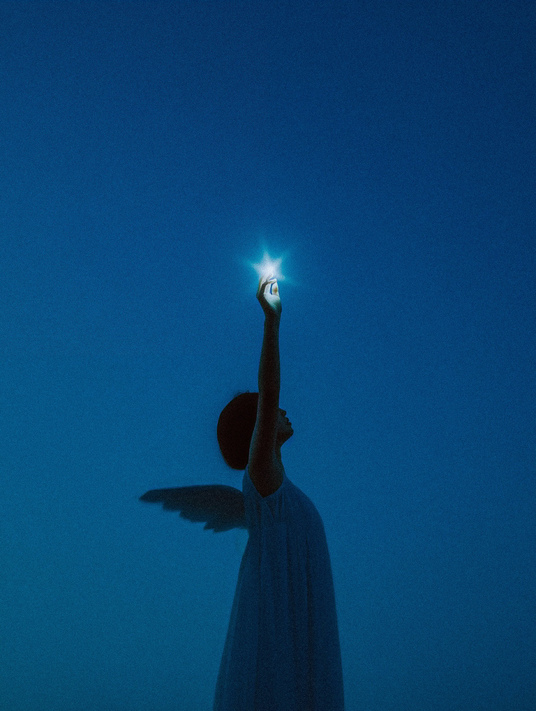 Woman Reaching Glowing Star Night