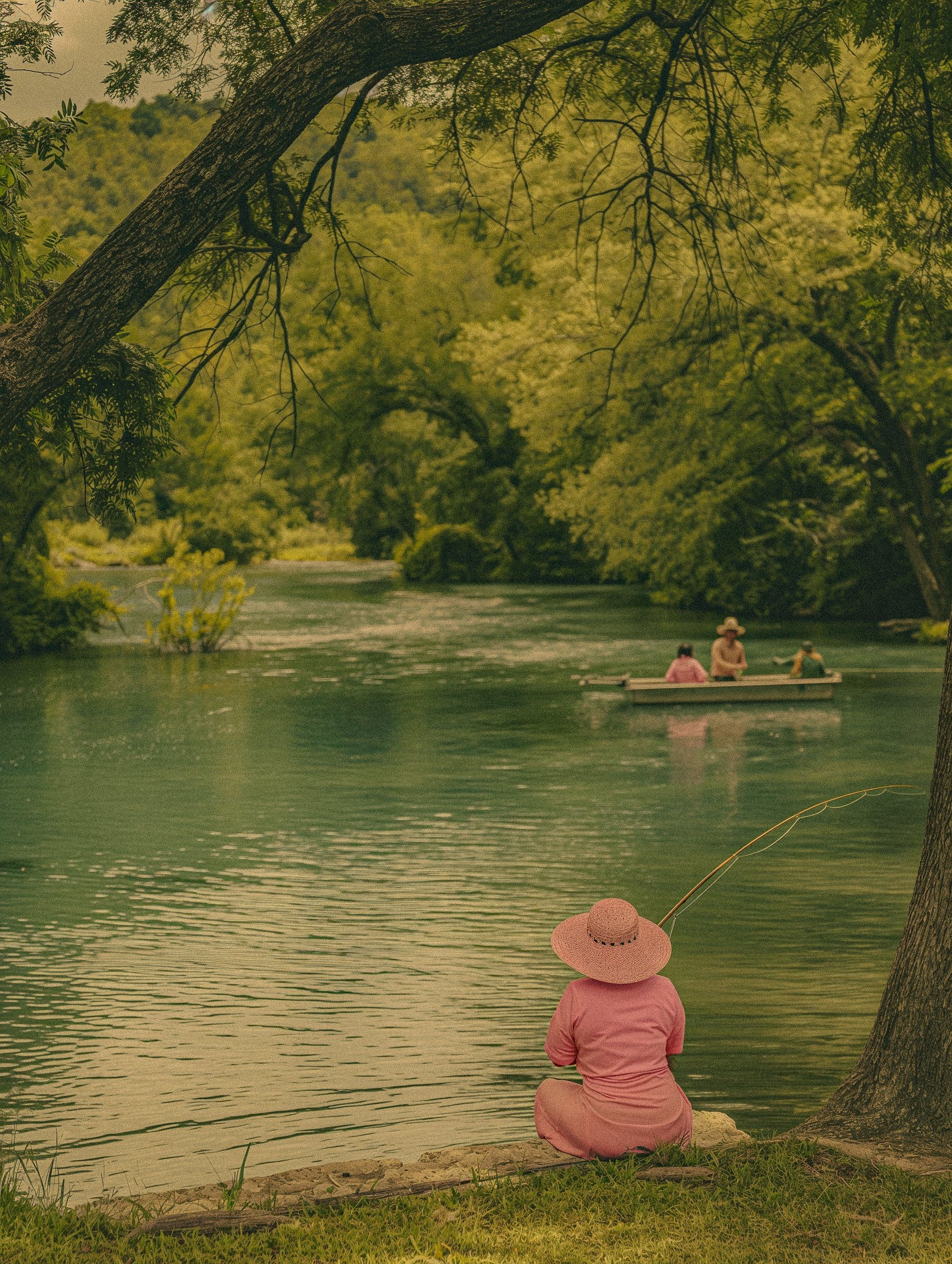woman fishing by the river