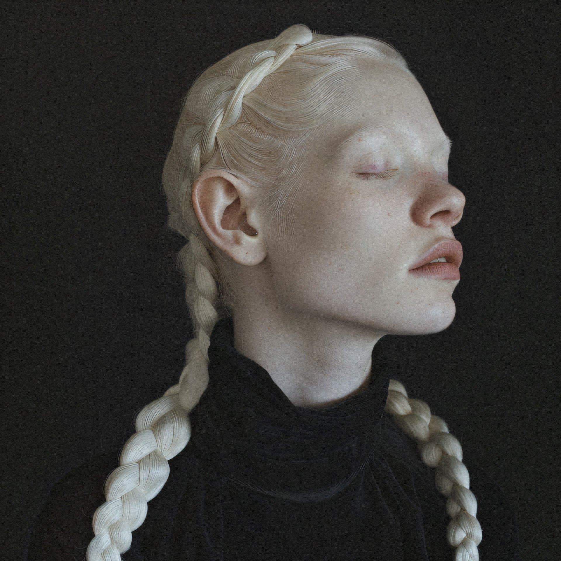 Albino model against black background