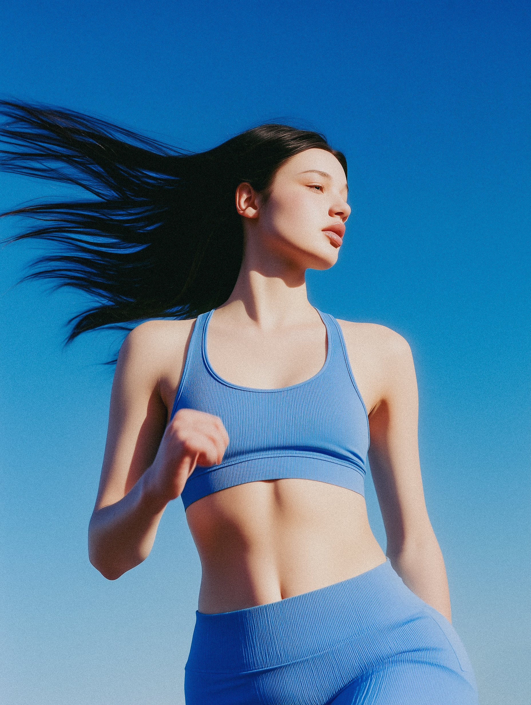 Woman moving in sunlight