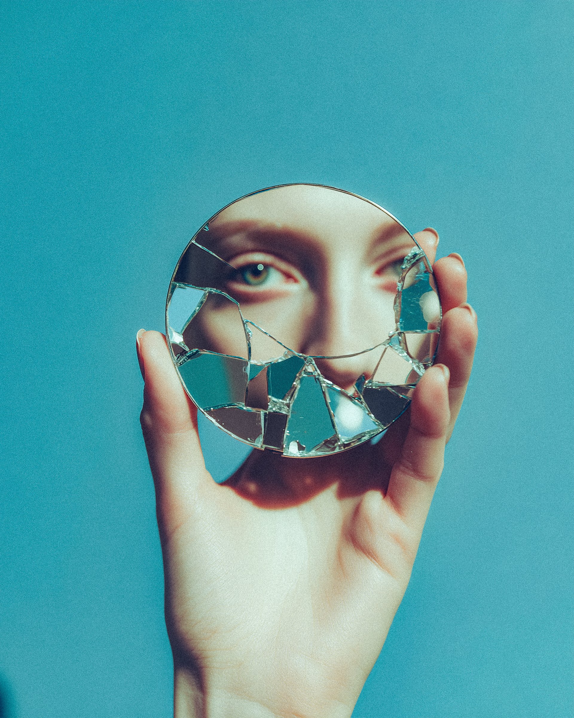 Woman Holding Broken Mirror Reflection
