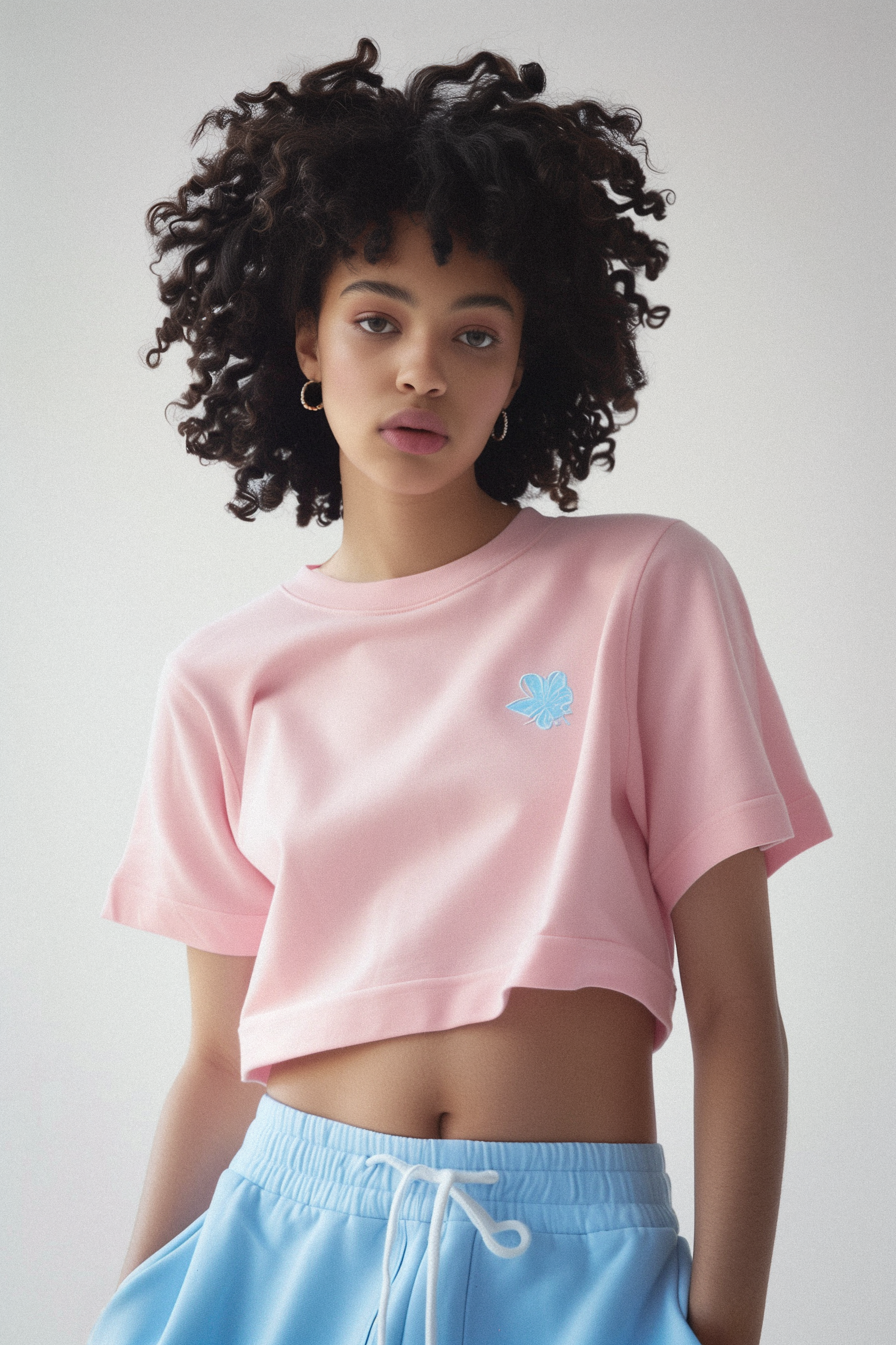 model wearing a pink crop top