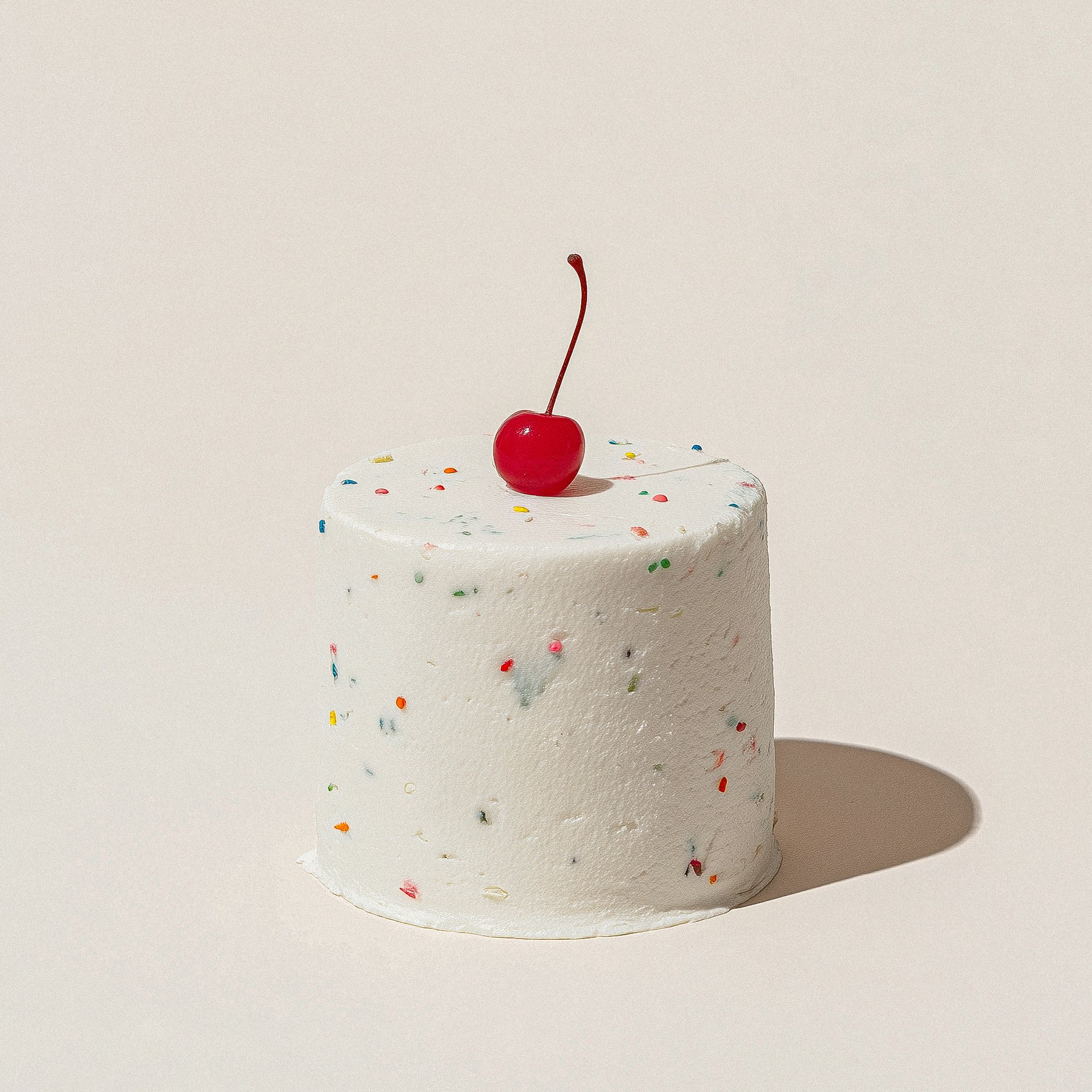 Minimal White Cake With Cherry