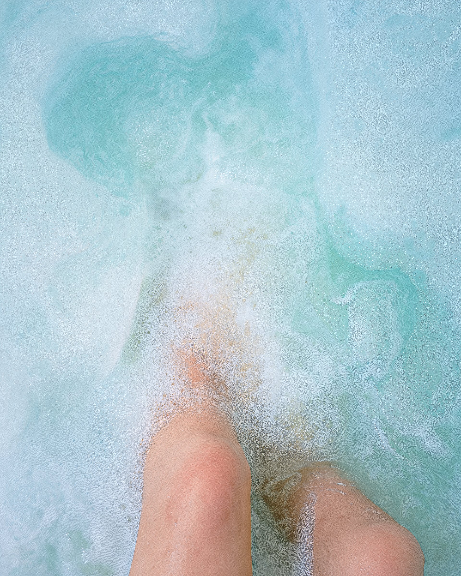 Knees in swirling water
