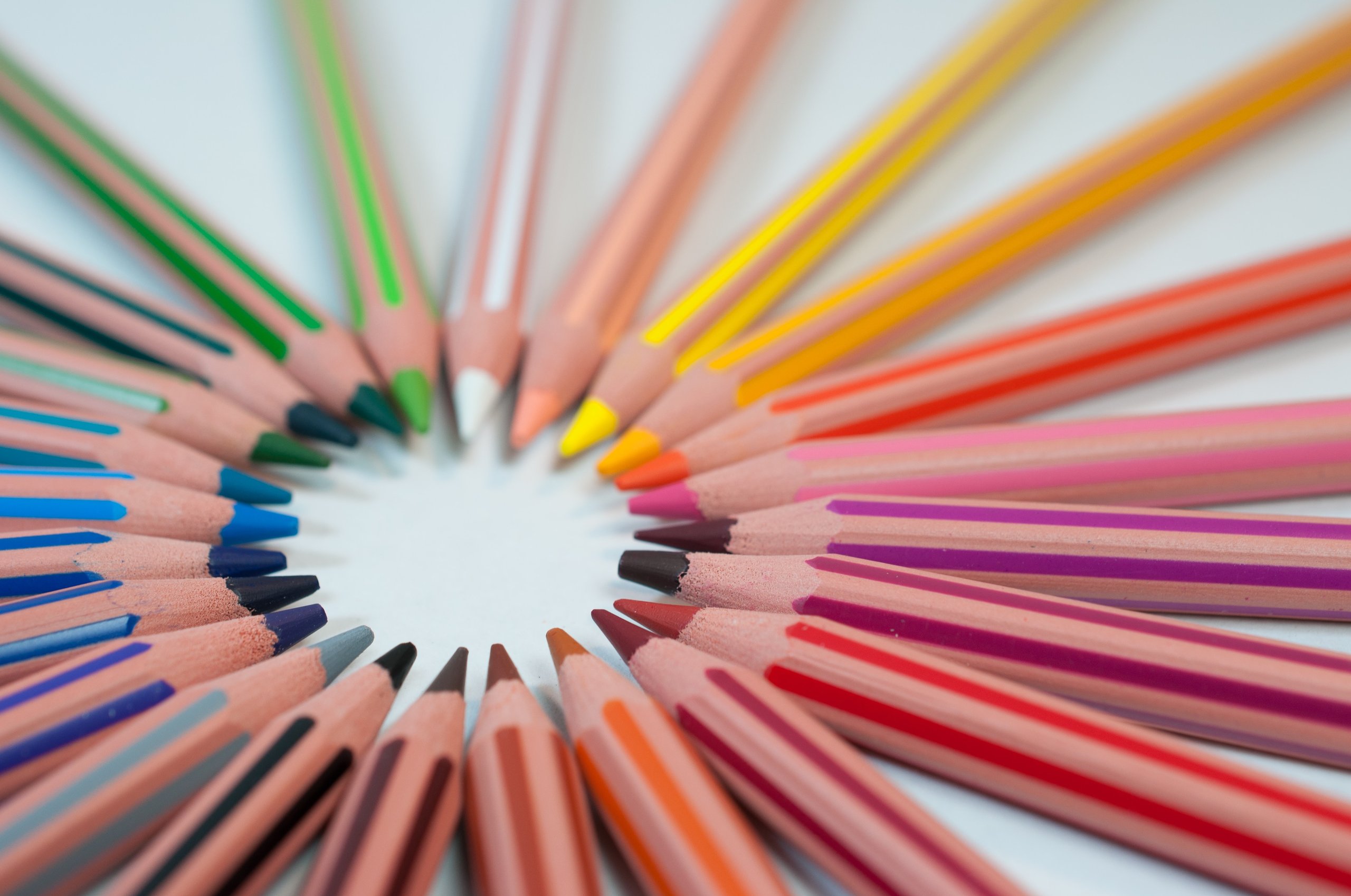 coloured pencils, arranged in a circle