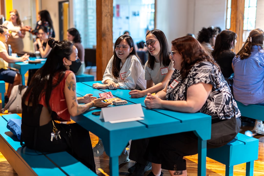 Students talk with arts industry professionals at discussion tables during the "Navigating a Career in the Arts, Culture & Media" event. Photo credit: Murphy Owusu