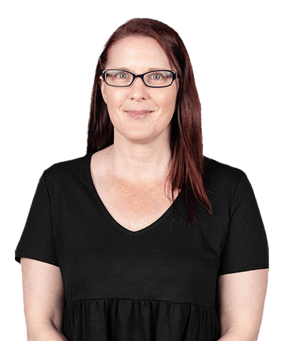 Nicola Ridgway, a woman with straight, shoulder-length reddish-brown hair and glasses, smiles at the camera. She is wearing a black short-sleeve top and is posed against a plain light background.