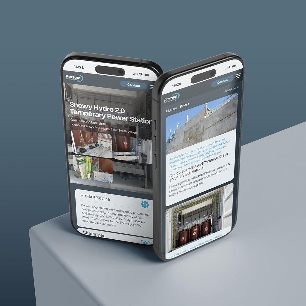 Two modern smartphones display a construction project webpage by Partum Engineering titled Snowy Hydro 2.0 Temporary Power Station, featuring images and project details. The phones are positioned on a grey surface.