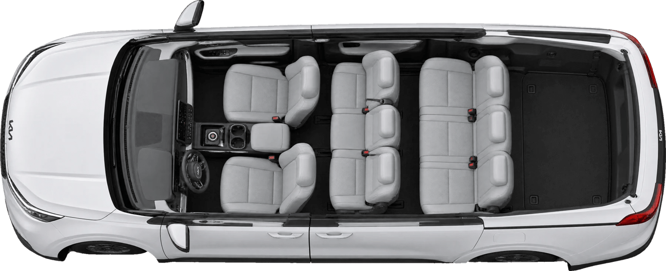 Kia Carnival visto desde arriba sin techo, con la familia acomodada