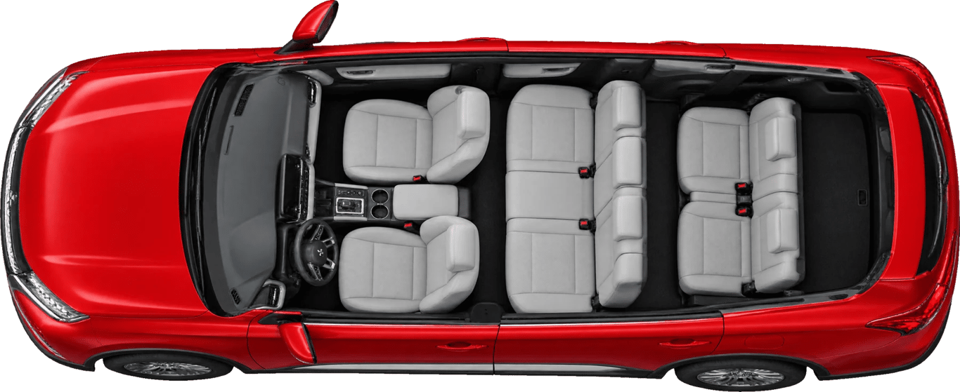 Mitsubishi Outlander visto desde arriba sin techo, con la familia acomodada
