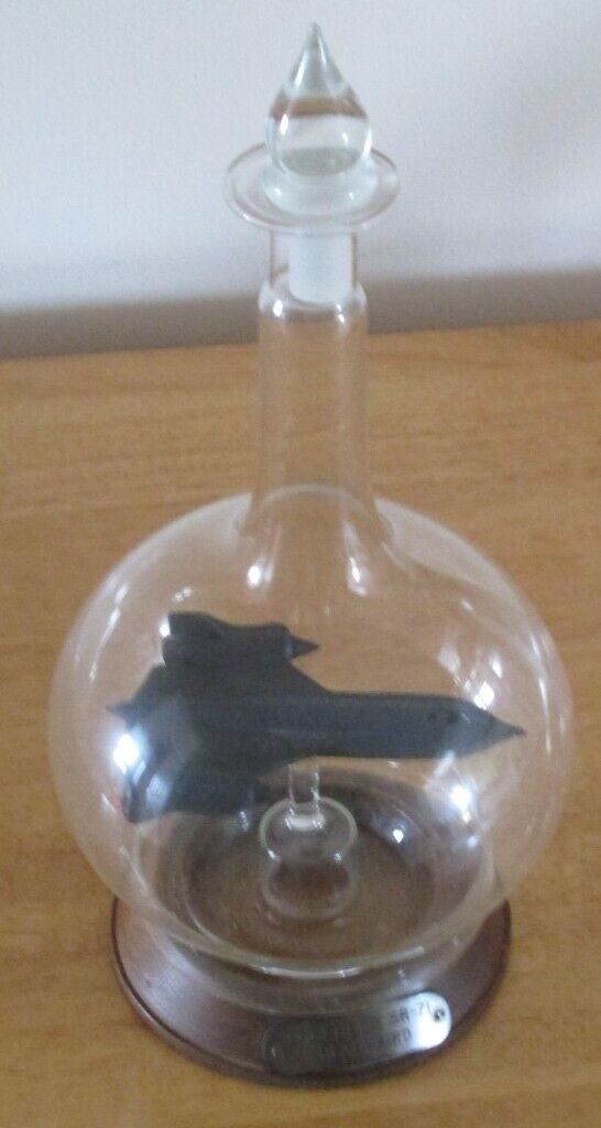 MODEL OF USAF SR 71 BLACKBIRD AIRCRAFT IN GLASS BOTTLE WITH STAND VGC